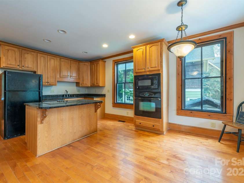 14 Harrison Street, Asheville, NC 28801.  MLS# CAR4181067, YatesRealty ID 6677. Spacious kitchen with island cooktop
