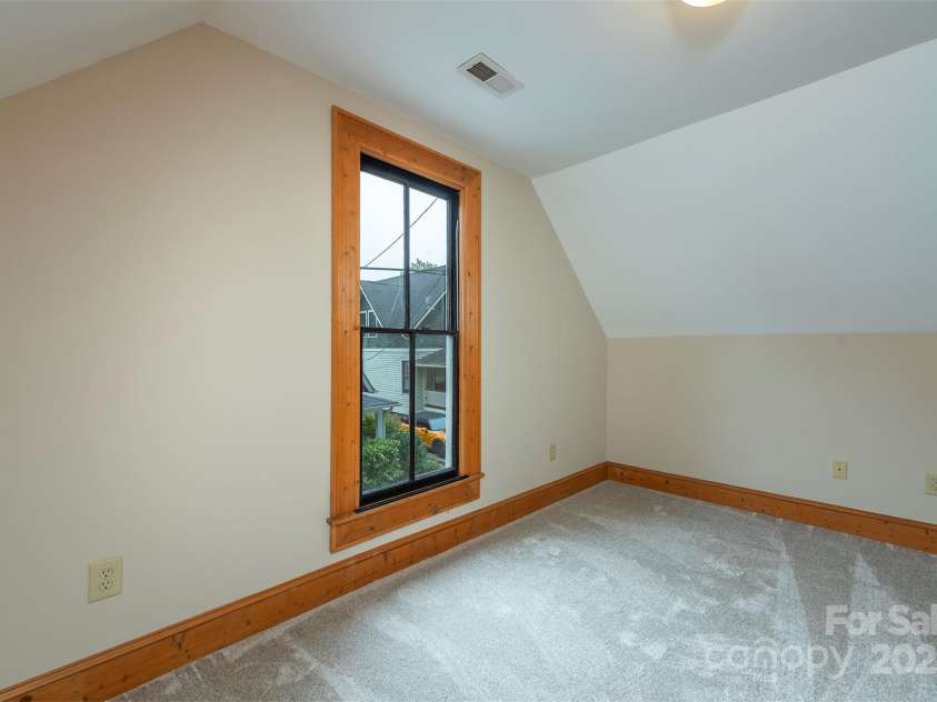 14 Harrison Street, Asheville, NC 28801.  MLS# CAR4181067, YatesRealty ID 6677. Upstairs bedroom 1 facing the street