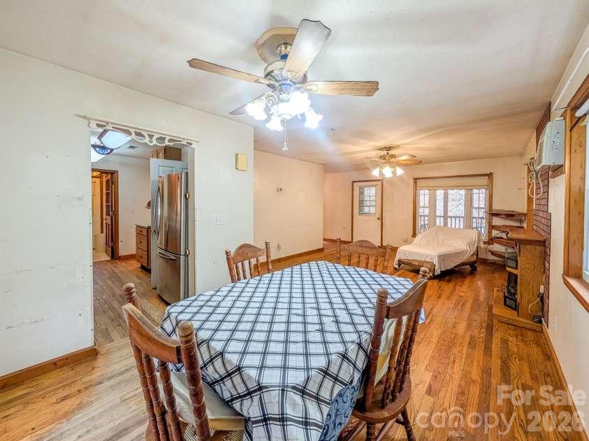 77 Griffith Branch Road, Green Mountain, NC 28740.  MLS# CAR4328405, YatesRealty ID 668. Small dining area in living room off from galley kitchen. 