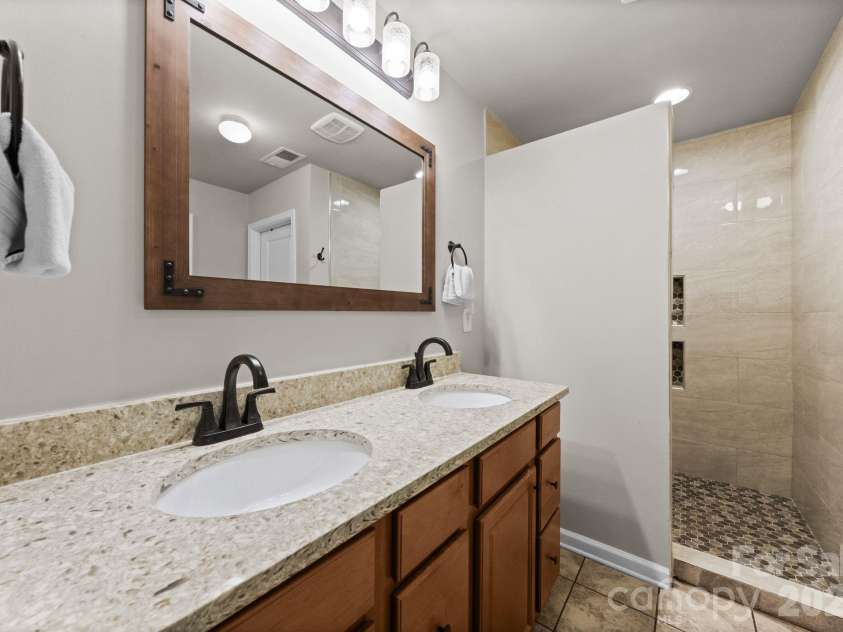 788 Rosegate Drive, Gastonia, NC 28056.  MLS# CAR4354667, YatesRealty ID 6689. Primary en-suite with dual vanities and walk in shower