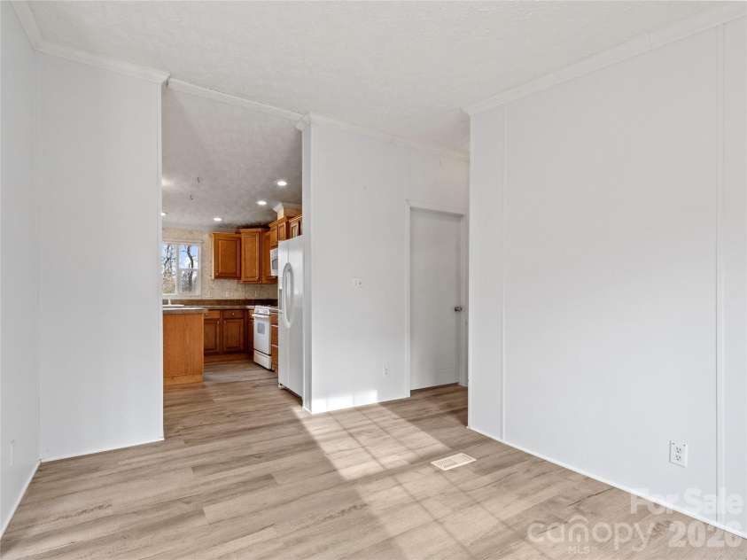 238 Cherry Hollow, Burnsville, NC 28714.  MLS# CAR4327901, YatesRealty ID 6698. Dining Room into Kitchen