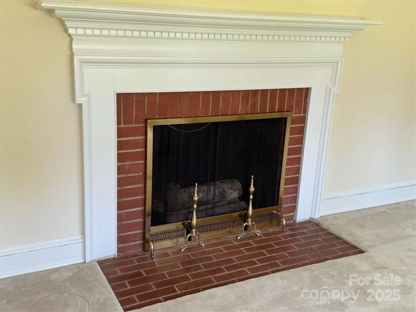 5119 Beckford Drive, Charlotte, NC 28226.  MLS# CAR4247630, YatesRealty ID 6706. Formel fireplace in the living room. Hardwood flooring under all carpeting.