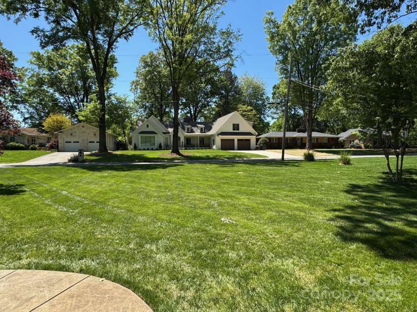 5119 Beckford Drive, Charlotte, NC 28226.  MLS# CAR4247630, YatesRealty ID 6706. Step to the front door and enjoy a picture-perfect view across Beckford Drive, where the beautifully maintained neighbor’s property creates a stunning, serene backdrop. A true example of pride of ownership in the neighb