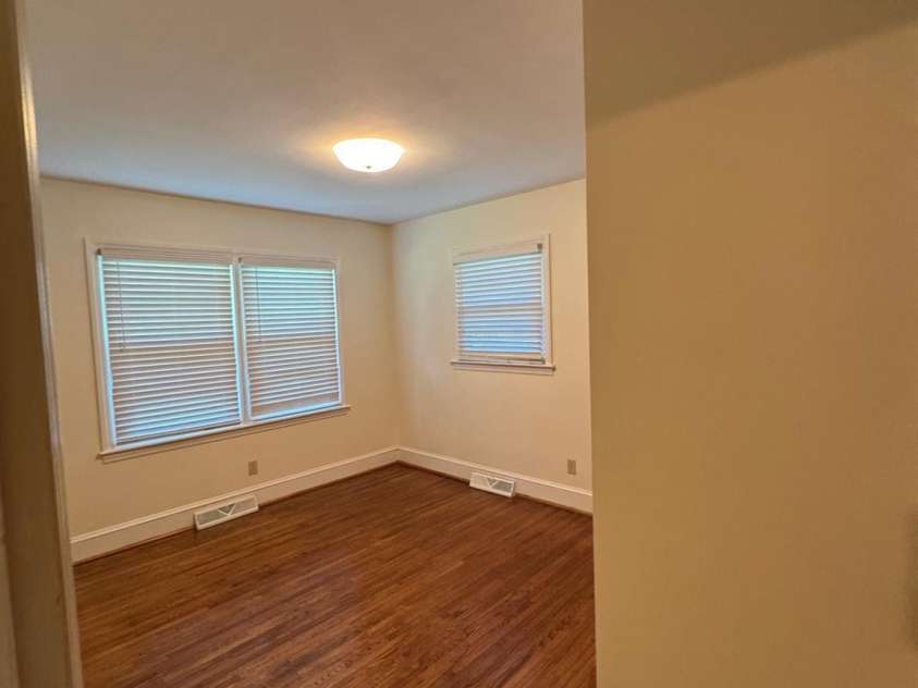 5119 Beckford Drive, Charlotte, NC 28226.  MLS# CAR4247630, YatesRealty ID 6706. The second guest bedroom is well-proportioned, complete with a spacious closet and stunning hardwood floors, providing both functionality and style