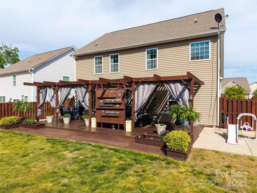 4607 Bonroi Avenue, Charlotte, NC 28213.  MLS# CAR4248280, YatesRealty ID 6713. Custom built 16x36 patio and outdoor living space with built in planters and extra concrete areas for grilling, getting extra sun or additional living space