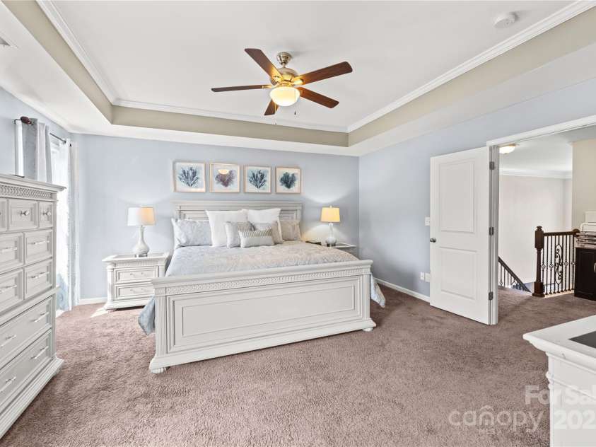 4607 Bonroi Avenue, Charlotte, NC 28213.  MLS# CAR4248280, YatesRealty ID 6713. Double door adorn this large primary suite.  This view was taken from the primary bathroom and shows the large landing just outside the double suite doors