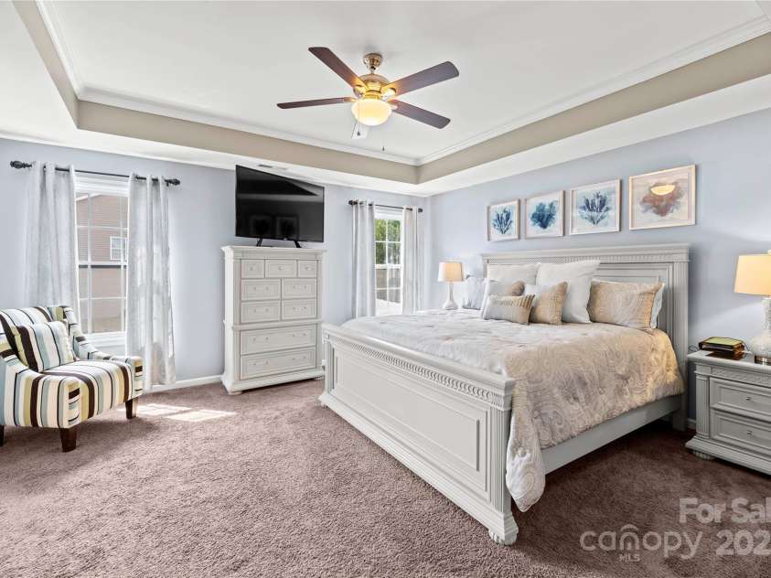 4607 Bonroi Avenue, Charlotte, NC 28213.  MLS# CAR4248280, YatesRealty ID 6713. Grand primary suite with trey ceilings and lots of light.  This room is so large it host oversize bedroom furniture and still has tons of space.  To the left of this view is the entry to the primary bathroom