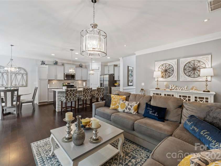 4607 Bonroi Avenue, Charlotte, NC 28213.  MLS# CAR4248280, YatesRealty ID 6713. Standing at the gas fireplace, get a glimpse of the open floor plan looking into the kitchen and the breakfast area