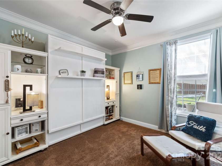 4607 Bonroi Avenue, Charlotte, NC 28213.  MLS# CAR4248280, YatesRealty ID 6713. The downstairs bedroom/office host built in shelving and a pull down murphy bed making this space a nice home office or easily converted into an extra guest room.