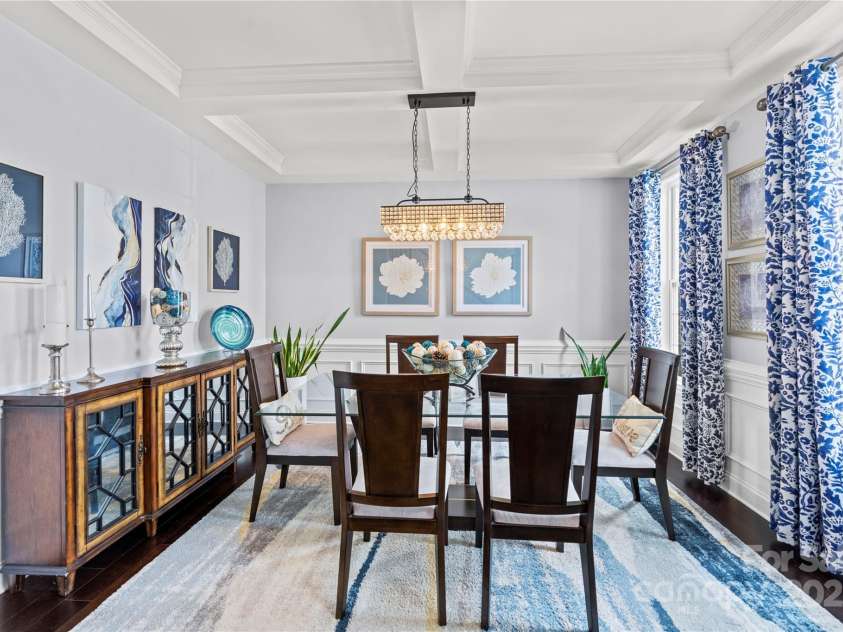4607 Bonroi Avenue, Charlotte, NC 28213.  MLS# CAR4248280, YatesRealty ID 6713. This breathtaking formal dining room could grace the cover of interior magazines.  The large windows let in lots of light, high end lighting accents the space and the coffered ceilings and wainscoting are gorgeous featur