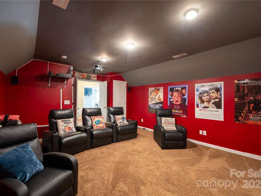 4607 Bonroi Avenue, Charlotte, NC 28213.  MLS# CAR4248280, YatesRealty ID 6713. This view in the bonus room is standing in front of the movie screen looking out into the landing area.  This room host a nice size closet and could also be use as a bedroom.