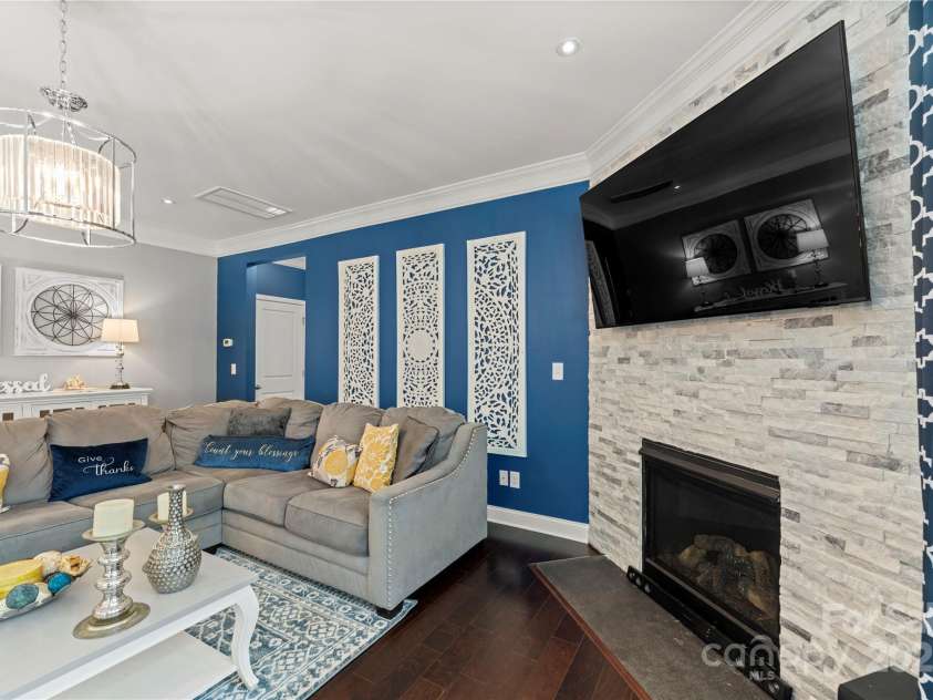 4607 Bonroi Avenue, Charlotte, NC 28213.  MLS# CAR4248280, YatesRealty ID 6713. This view is standing at the back door and getting the beautiful custom stone gas fireplace in the pic