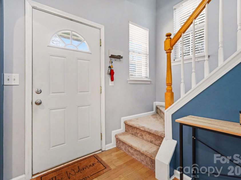 8411 Chaceview Court, Charlotte, NC 28269.  MLS# CAR4357528, YatesRealty ID 6714. Grand stairwell with 3 windows