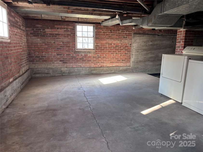 1307 Hyman Avenue, Hendersonville, NC 28792.  MLS# CAR4208395, YatesRealty ID 6717. Basement - Laundry plus storage