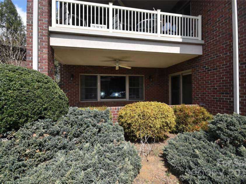 1465 Lakeshore Drive, Lake Junaluska, NC 28745.  MLS# CAR4241978, YatesRealty ID 6718. Very nice front porch to catch the lake breezes