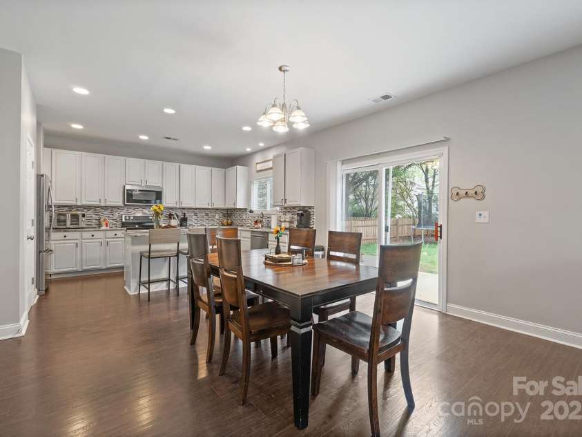 10241 Barrands Lane, Charlotte, NC 28278.  MLS# CAR4239355, YatesRealty ID 6735. Dining Area and Kitchen with Convenient Slider to Rear Yard and Patio