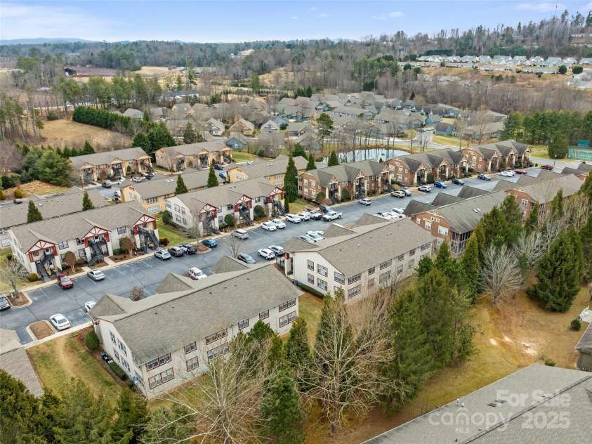 1206 Deermouse Way, Hendersonville, NC 28792.  MLS# CAR4221360, YatesRealty ID 6748. Fishing Pond across the street on the backside of the condominiums.