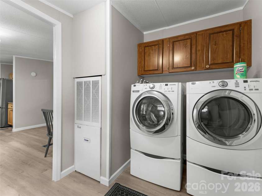 25 Overbrook Drive, Saluda, NC 28773.  MLS# CAR4306681, YatesRealty ID 6758. Convenient laundry room off kitchen.