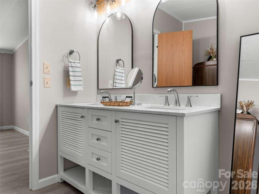 25 Overbrook Drive, Saluda, NC 28773.  MLS# CAR4306681, YatesRealty ID 6758. Double vanity in primary suite bath. 