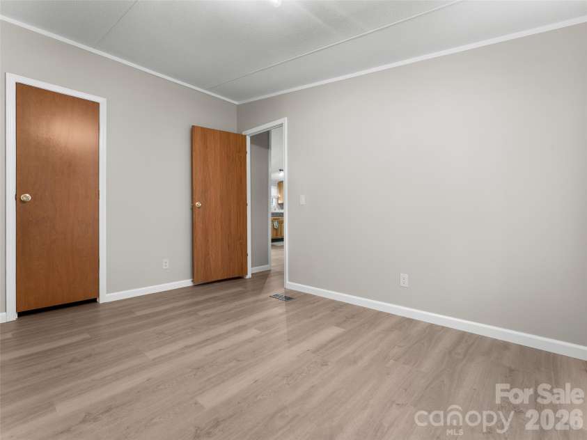 25 Overbrook Drive, Saluda, NC 28773.  MLS# CAR4306681, YatesRealty ID 6758. Each bedroom is generously sized and includes a functional closet. 