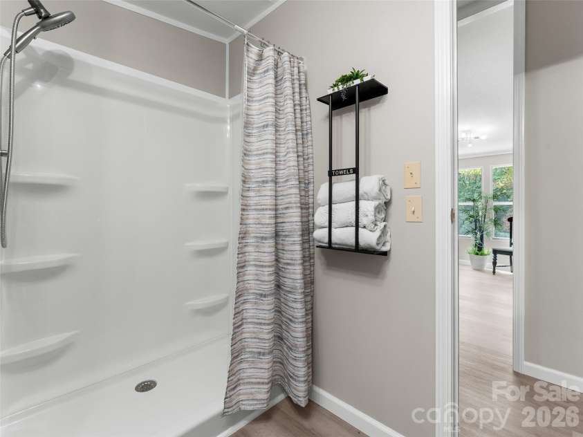 25 Overbrook Drive, Saluda, NC 28773.  MLS# CAR4306681, YatesRealty ID 6758. Step-in shower in second bathroom. 