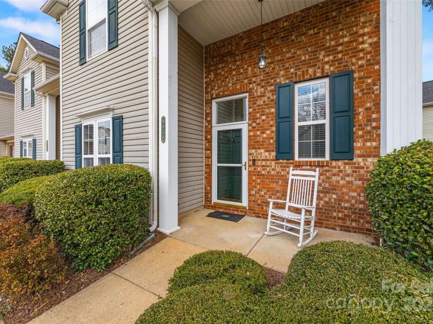 8830 Cinnabay Drive, Charlotte, NC 28216.  MLS# CAR4227249, YatesRealty ID 6758. Adorable front porch