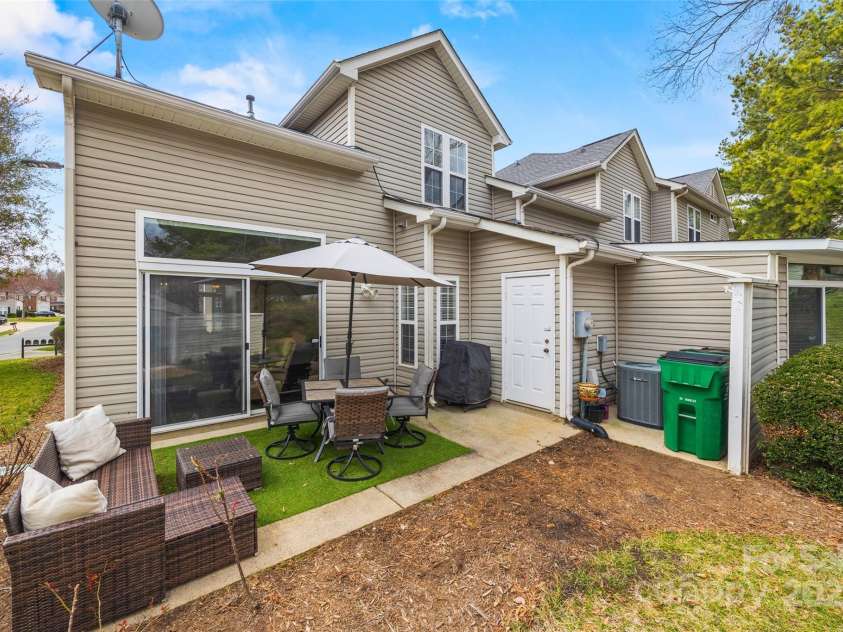 8830 Cinnabay Drive, Charlotte, NC 28216.  MLS# CAR4227249, YatesRealty ID 6758. Lovely patio with exterior storage closet
