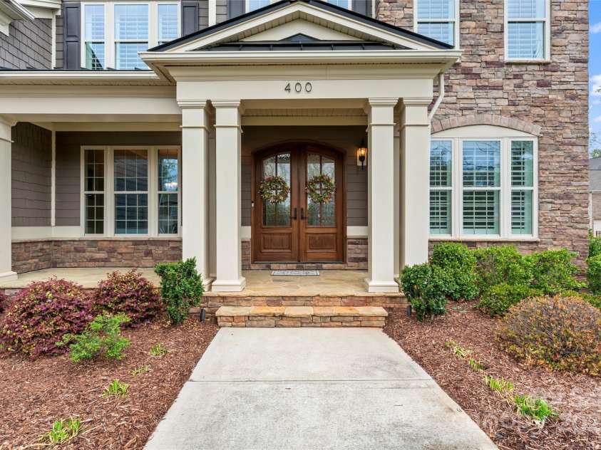 400 Eden Hollow Lane, Weddington, NC 28104.  MLS# CAR4243041, YatesRealty ID 6765. Front porch to relax on