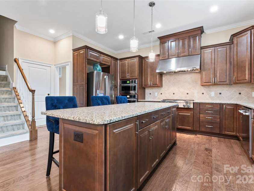 400 Eden Hollow Lane, Weddington, NC 28104.  MLS# CAR4243041, YatesRealty ID 6765. Secondary staircase off of kitchen