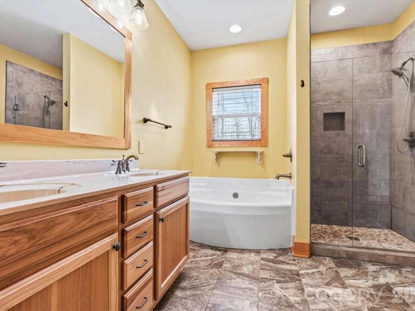3108 Arden Way, Claremont, NC 28610.  MLS# CAR4352578, YatesRealty ID 6770. Primary Bath/Soaking Tub & Tile Shower View 