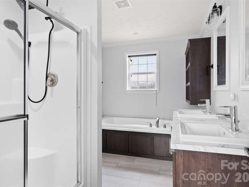 105 Stormy Way, Waynesville, NC 28785.  MLS# CAR4360407, YatesRealty ID 6780. Primary ensuite bathroom
