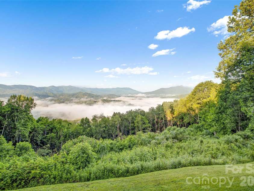 1087 Brigadoon Drive, Clyde, NC 28721.  MLS# CAR4362911, YatesRealty ID 6781. Above the clouds yet easy access