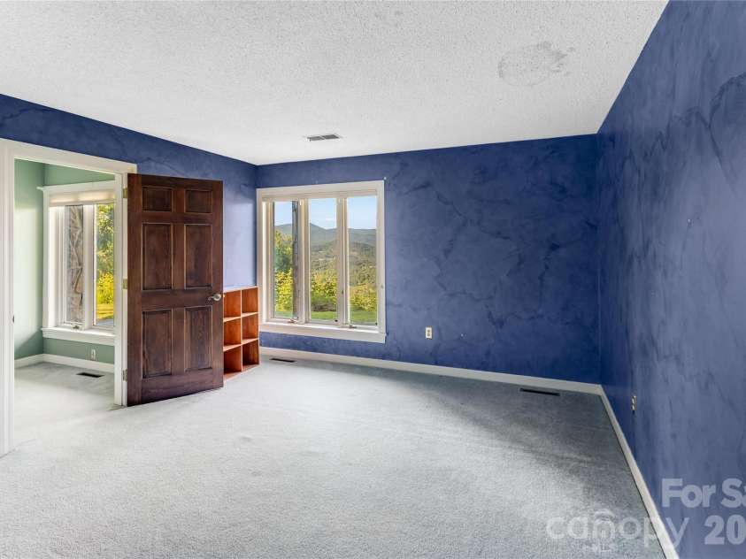 1087 Brigadoon Drive, Clyde, NC 28721.  MLS# CAR4362911, YatesRealty ID 6781. Bedroom 3- lower level
