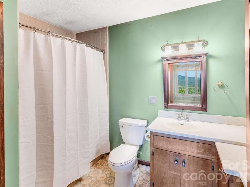 1087 Brigadoon Drive, Clyde, NC 28721.  MLS# CAR4362911, YatesRealty ID 6781. Lower level full bath