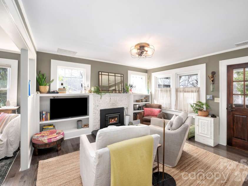 21 Craig Circle, Asheville, NC 28805.  MLS# CAR4359482, YatesRealty ID 6791. Built-In Display Shelves Frame Fireplace
