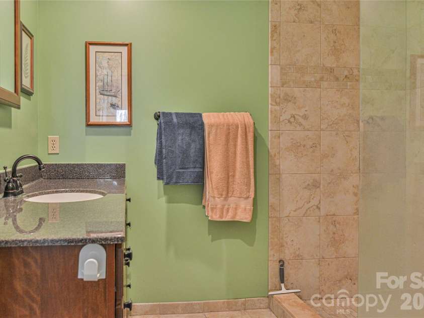 1301 Hyde Park Drive, Asheville, NC 28806.  MLS# CAR4336141, YatesRealty ID 6793. The walk-in shower and primary bath