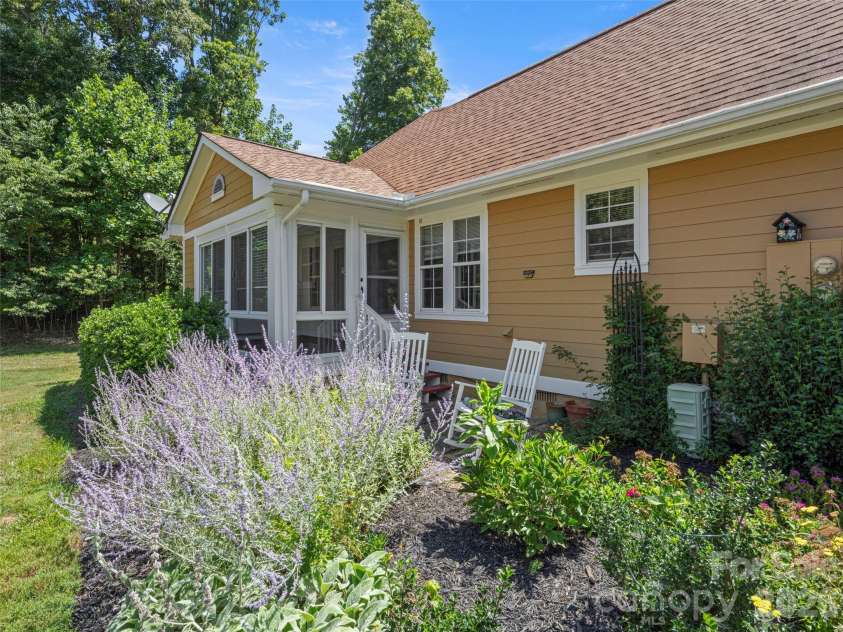 1301 Hyde Park Drive, Asheville, NC 28806.  MLS# CAR4399054, YatesRealty ID 6793. Back space and flower garden