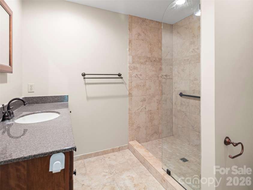 1301 Hyde Park Drive, Asheville, NC 28806.  MLS# CAR4399054, YatesRealty ID 6793. Primary bath with walk-in shower