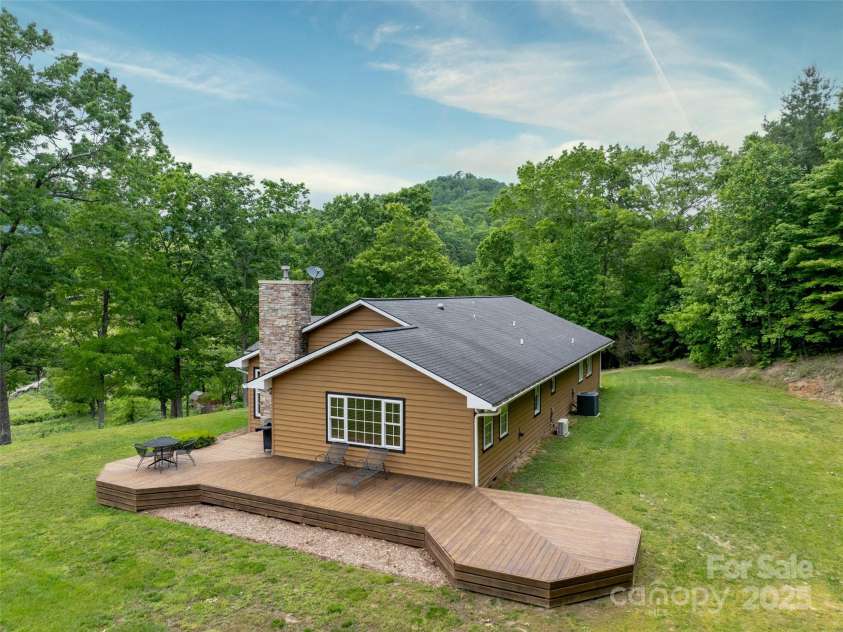 609 Fork Road, Black Mountain, NC 28711.  MLS# CAR4232280, YatesRealty ID 6793. Nice level back and side yard for garden or pool.