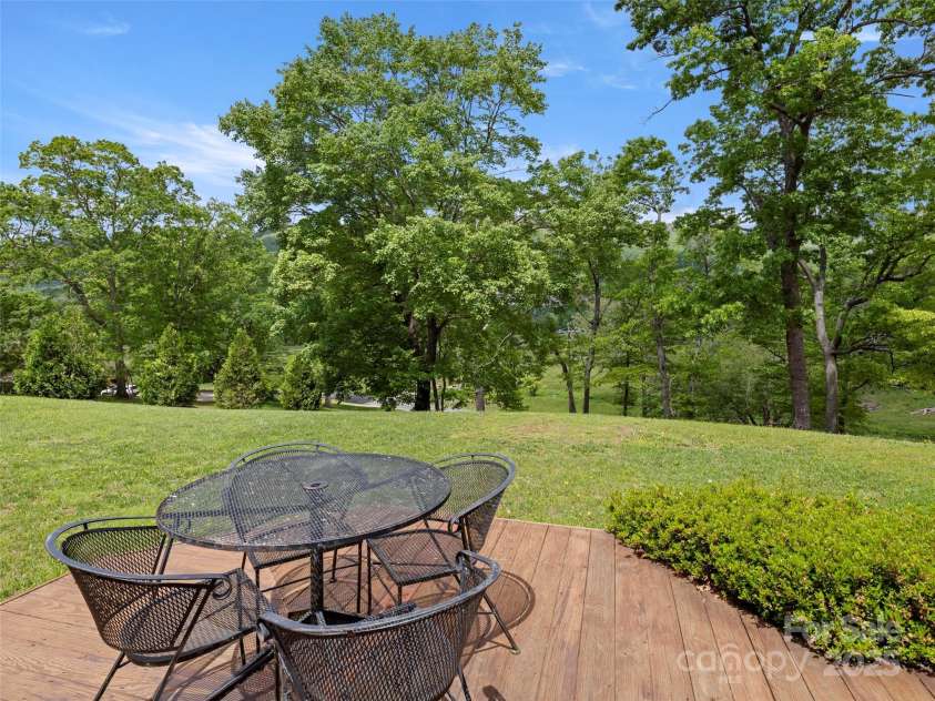 609 Fork Road, Black Mountain, NC 28711.  MLS# CAR4232280, YatesRealty ID 6793. Side deck in spring