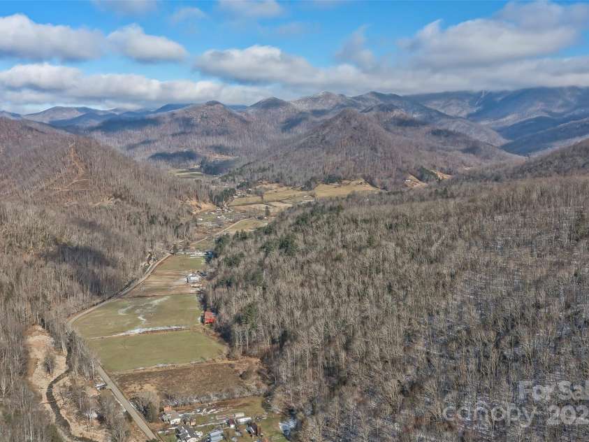 183 Stoney Fork Road, Barnardsville, NC 28709.  MLS# CAR4213332, YatesRealty ID 6809. Aerial view of the valley below