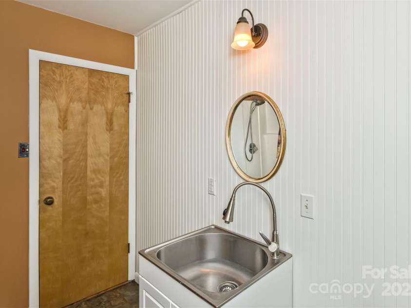 183 Stoney Fork Road, Barnardsville, NC 28709.  MLS# CAR4213332, YatesRealty ID 6809. Bath sink also be used as utlity sink