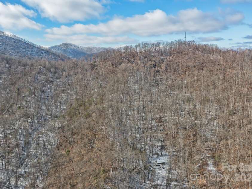 183 Stoney Fork Road, Barnardsville, NC 28709.  MLS# CAR4213332, YatesRealty ID 6809. Elevated view of the land