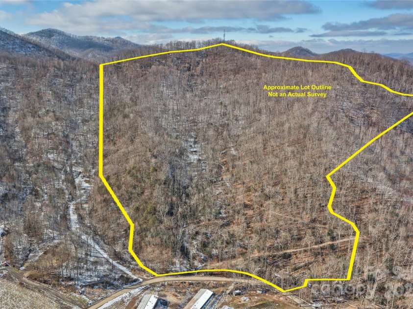 183 Stoney Fork Road, Barnardsville, NC 28709.  MLS# CAR4213332, YatesRealty ID 6809. Mountain Cabin surrounded by an Abundance of Land