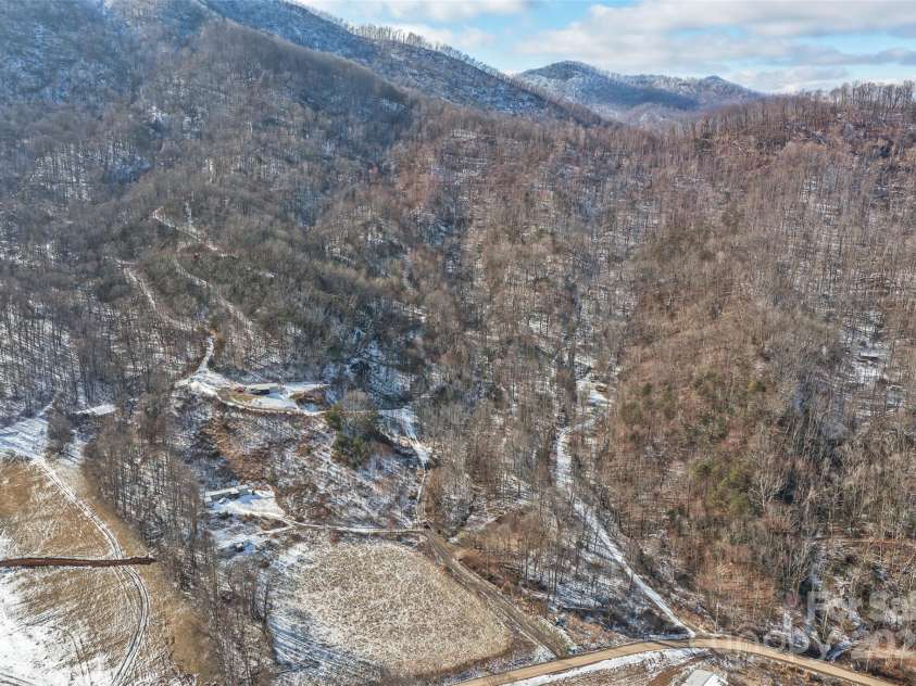 183 Stoney Fork Road, Barnardsville, NC 28709.  MLS# CAR4213332, YatesRealty ID 6809. Several build sites throughout the land