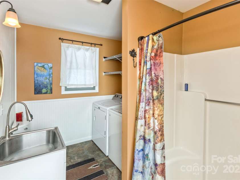 183 Stoney Fork Road, Barnardsville, NC 28709.  MLS# CAR4213332, YatesRealty ID 6809. Shower also in the laundry/bath area