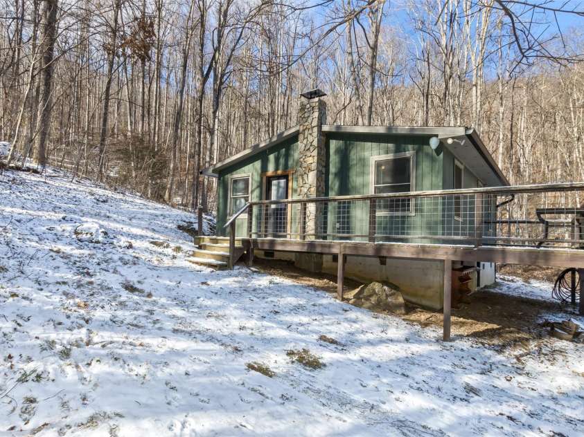 183 Stoney Fork Road, Barnardsville, NC 28709.  MLS# CAR4213332, YatesRealty ID 6809. Side view of the cabin
