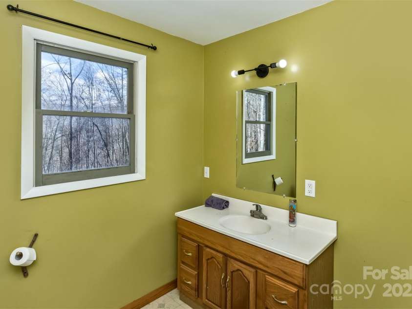 183 Stoney Fork Road, Barnardsville, NC 28709.  MLS# CAR4213332, YatesRealty ID 6809. Sink in primary bath