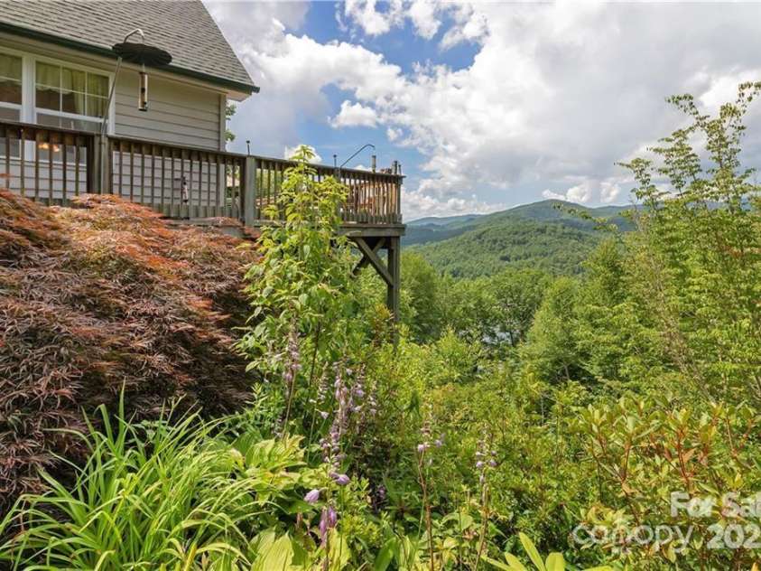612 Old Home Place Road, Tuckasegee, NC 28783.  MLS# CAR4300096, YatesRealty ID 681. Large Deck Overlooking Wolf Lake