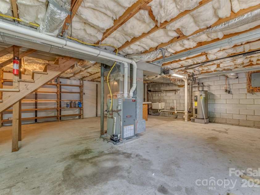 8749 Nc 63 Highway, Leicester, NC 28748.  MLS# CAR4214996, YatesRealty ID 681. Workspace with 8749 garage
